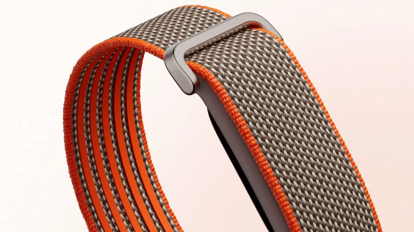 نسخه ویژه استفن کری از Google Fitbit Air با بند پارچه‌ای خاکستری و حاشیه‌های نارنجی
